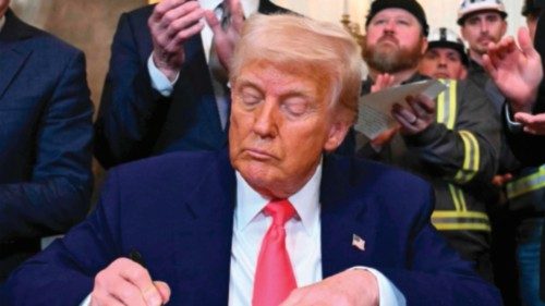 TOPSHOT - US President Donald Trump signs an executive order to boost coal mining and production in ... TOPSHOT - US President Donald Trump signs an executive order to boost coal mining and production in ...