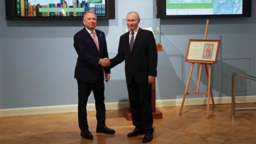 In this pool photograph distributed by the Russian state agency Sputnik, Russia's President Vladimir ... In this pool photograph distributed by the Russian state agency Sputnik, Russia's President Vladimir ...
