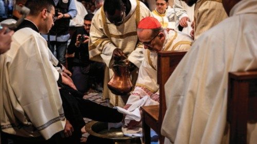 Pierbattista Pizzaballa (C), the Latin Patriarch of Jerusalem, washes a foot during the Washing of ... Pierbattista Pizzaballa (C), the Latin Patriarch of Jerusalem, washes a foot during the Washing of ...