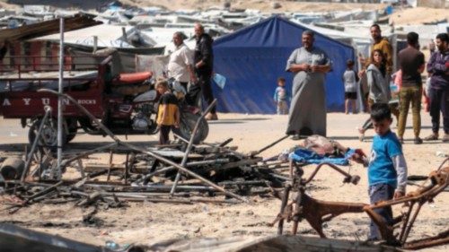 People inspect the remains of a tent shelter that was reportedly hit by an Israeli strike in Khan ... People inspect the remains of a tent shelter that was reportedly hit by an Israeli strike in Khan ...