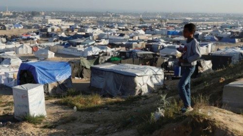 A boy looks on as displaced Palestinians shelter in a tent camp in Khan Younis in the southern Gaza ... A boy looks on as displaced Palestinians shelter in a tent camp in Khan Younis in the southern Gaza ...