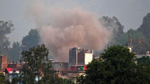 Smoke billows after an artillery shell landed in the main town of Poonch district in India's Jammu ... Smoke billows after an artillery shell landed in the main town of Poonch district in India's Jammu ...