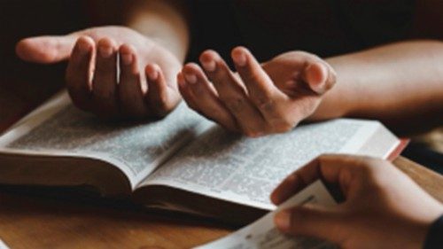 Christian group of people holding hands praying worship together to believe and Bible on a wooden ... Christian group of people holding hands praying worship together to believe and Bible on a wooden ...