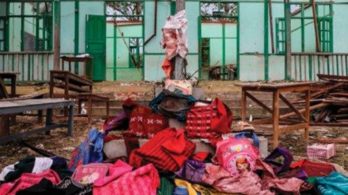 TOPSHOT - Students' bags are kept in front of a school building damaged in a bombardment carried out ... TOPSHOT - Students' bags are kept in front of a school building damaged in a bombardment carried out ...