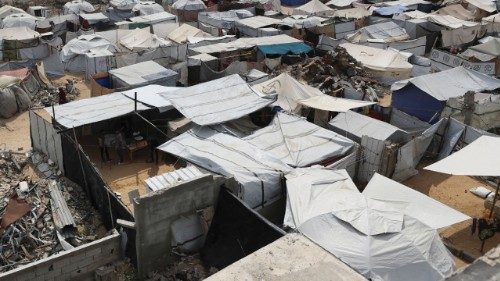 Palestinians displaced by the Israeli military offensive, shelter in a tent camp, in Gaza City, May ... Palestinians displaced by the Israeli military offensive, shelter in a tent camp, in Gaza City, May ...