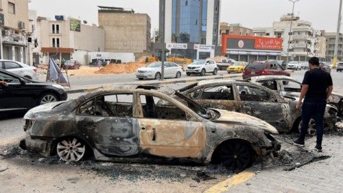 epa12099541 Burned cars pictured in the street after clashes in Tripoli, Libya, 14 May 2025. Flights ... epa12099541 Burned cars pictured in the street after clashes in Tripoli, Libya, 14 May 2025. Flights ...