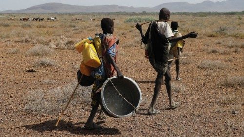 Turkana herd boys walk in search of water and pasture for their animals at the Lorengo village of ...