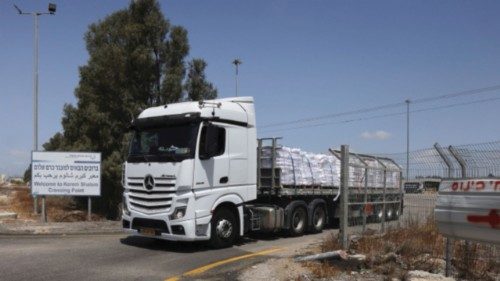 A truck carrying aid, makes its way to Gaza, at the Kerem Shalom crossing, on the Israeli side of ... A truck carrying aid, makes its way to Gaza, at the Kerem Shalom crossing, on the Israeli side of ...