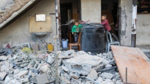 Palestinian boys look on at the site of an Israeli strike on a house, in Jabalia, northern Gaza ... Palestinian boys look on at the site of an Israeli strike on a house, in Jabalia, northern Gaza ...