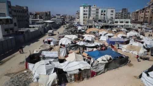 Palestinians displaced by the Israeli military offensive, shelter in tents, in Gaza City, May 20, ... Palestinians displaced by the Israeli military offensive, shelter in tents, in Gaza City, May 20, ...