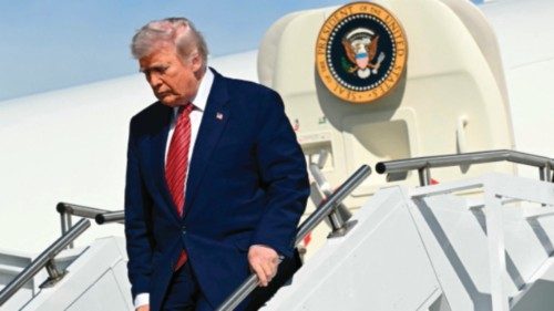 US President Donald Trump disembarks from Air Force One upon arrival at Morristown Municipal Airport ...