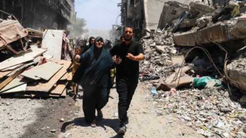 Palestinians evacuate in the aftermath of an Israeli strike on a house, in Gaza City, May 30, 2025. ... Palestinians evacuate in the aftermath of an Israeli strike on a house, in Gaza City, May 30, 2025. ...