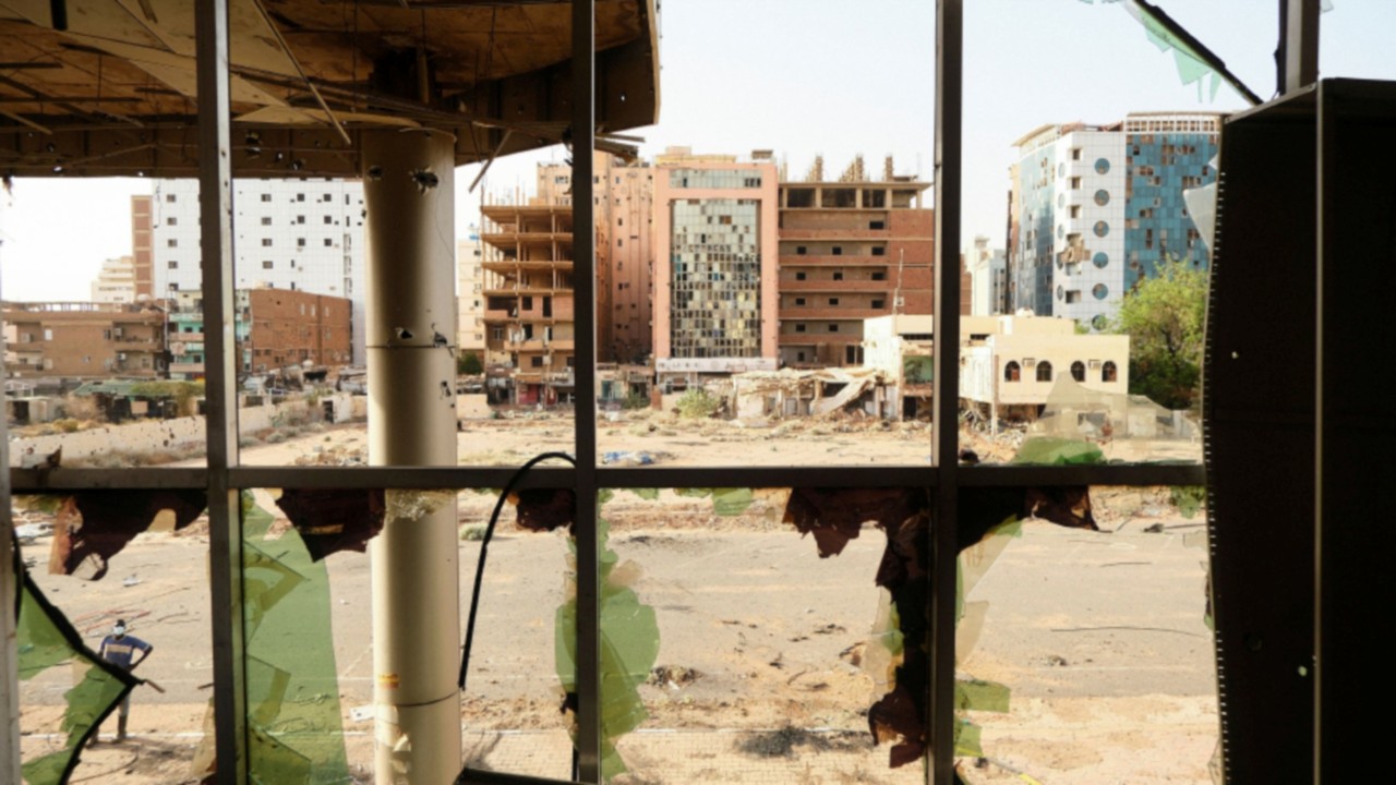 A view of the destroyed Khartoum Teaching Hospital building,as seen through the damaged windows of ...