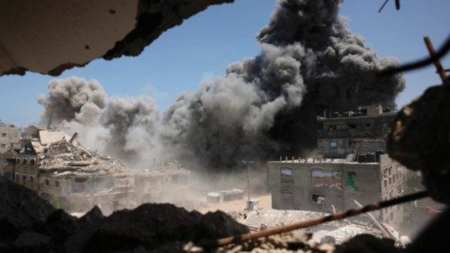 TOPSHOT - Smoke and debris rise following an Israeli strike on a house west of Jabalia, in the ... TOPSHOT - Smoke and debris rise following an Israeli strike on a house west of Jabalia, in the ...