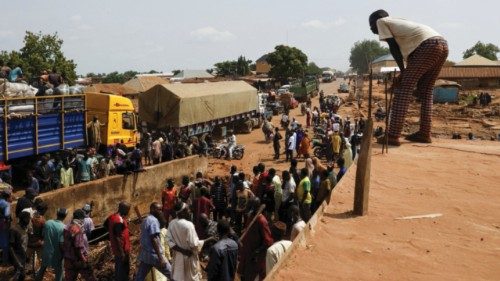 Trucks carrying food items are stranded on Anguwar Hausawa Gangari road, due to the flooding that ...