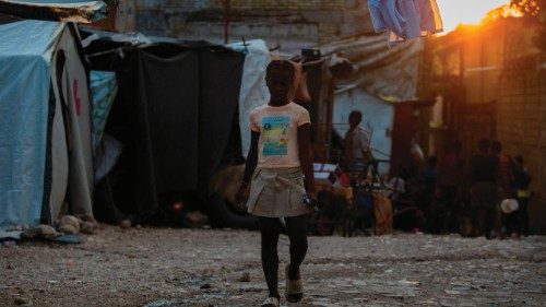 A girl walks in a displaced camp at Rex Theater in Port-au-Prince, Haiti, on May 23, 2025. A surge ...