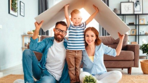 concept housing a young family. Mother father and child in new house with a roof at a home
