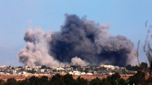 TOPSHOT - This picture, taken from the Israeli border with the Gaza Strip, shows smoke billowing ...