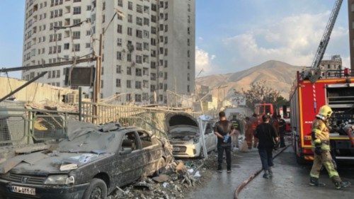 epa12172720 Fire fighters work outside a building that was hit by Israeli air strikes north of ... epa12172720 Fire fighters work outside a building that was hit by Israeli air strikes north of ...