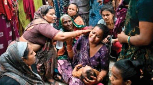 Women mourn their relatives killed the previous day after Air India flight 171 crashed in a ... Women mourn their relatives killed the previous day after Air India flight 171 crashed in a ...