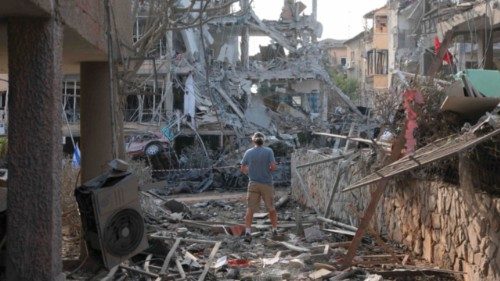 A personlooks on amid damaged buildings and vehicles in the Israeli city of Ramat Gan near Tel Aviv ... A personlooks on amid damaged buildings and vehicles in the Israeli city of Ramat Gan near Tel Aviv ...