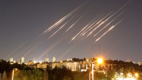 epa12175801 A slow exposure picture shows ballistic missiles above Jerusalem, 14 June 2025. Israel's ...