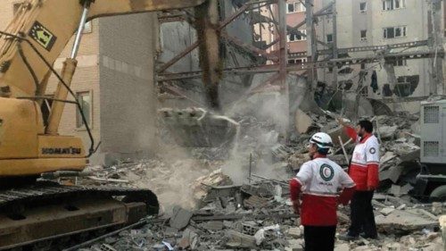 This handout picture provided by the Iranian Red Crescent on June 19, 2025 shows members of their ...