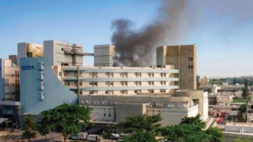 Smoke billows from a building at Soroka Hospital in Beersheba in southern Israel following an ... Smoke billows from a building at Soroka Hospital in Beersheba in southern Israel following an ...