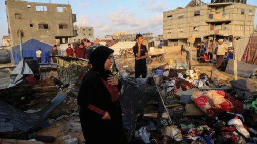 Palestinians inspect the damage at the site of an overnight Israeli air strike on a tent sheltering ... Palestinians inspect the damage at the site of an overnight Israeli air strike on a tent sheltering ...