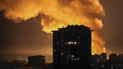 An explosion of a drone lights up the sky over the city during a Russian drone and missile strike, ... An explosion of a drone lights up the sky over the city during a Russian drone and missile strike, ...