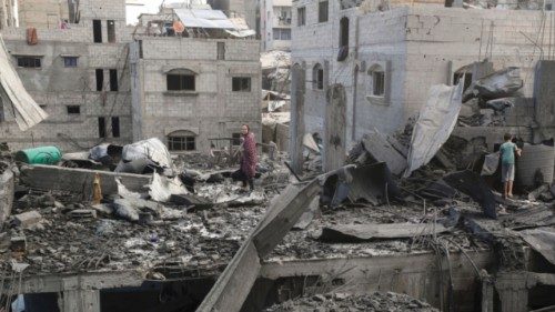 Palestinians inspect the site of Thursday's Israeli strike that damaged and destroyed residential ... Palestinians inspect the site of Thursday's Israeli strike that damaged and destroyed residential ...