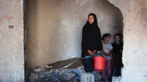 People inspect the damage after a reported Israeli strike on a clinic-turned-shelter in the northern ... People inspect the damage after a reported Israeli strike on a clinic-turned-shelter in the northern ...