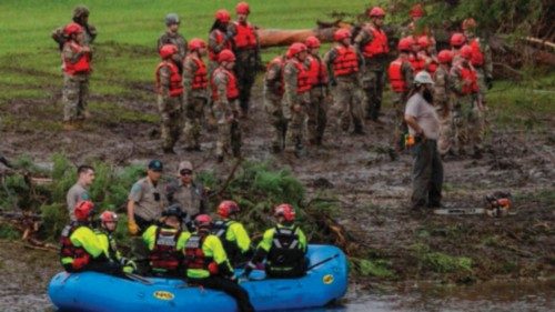 HUNT, TEXAS - JULY 6: Search and recovery workers dig through debris looking for any survivors or ... HUNT, TEXAS - JULY 6: Search and recovery workers dig through debris looking for any survivors or ...