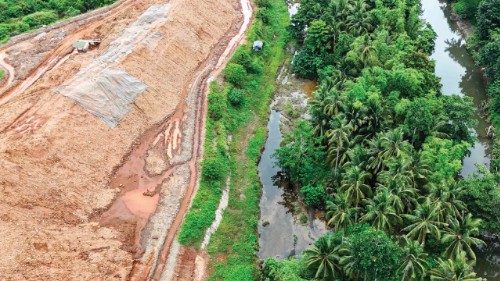 In this aerial photo taken on May 24, 2025, growing stockpiles of nickel tower over the rice paddy ... In this aerial photo taken on May 24, 2025, growing stockpiles of nickel tower over the rice paddy ...