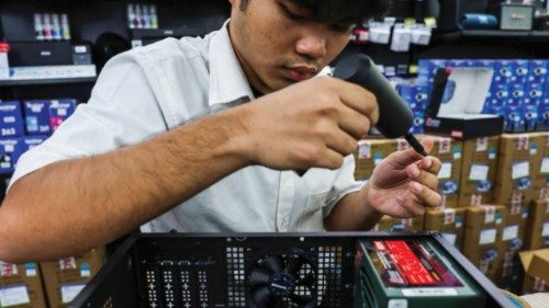A man builds a custom PC for a customer at an IT mall, following the announcement that U.S. ... A man builds a custom PC for a customer at an IT mall, following the announcement that U.S. ...