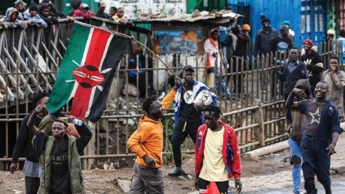 epa12222997 A Kenyan protester waves the Kenyan flag during anti-government protests on Saba Saba ...