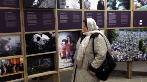 epa12226465 (FILE) -Local visitor Nura Alispahic looks at a photographic display in the newly-opened ... epa12226465 (FILE) -Local visitor Nura Alispahic looks at a photographic display in the newly-opened ...