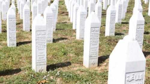 Bosnian Muslims gather amid grave stones of victims killed during the Srebrenica genocide, at the ... Bosnian Muslims gather amid grave stones of victims killed during the Srebrenica genocide, at the ...