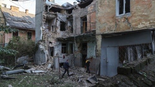 Residents inspect the site of an apartment building damaged during Russian drone and missile ... Residents inspect the site of an apartment building damaged during Russian drone and missile ...