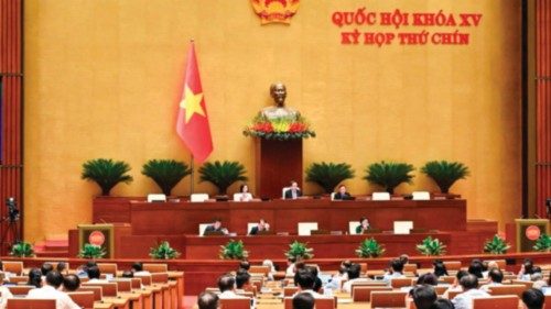 (FILES) Vietnamese lawmakers take part in a vote on merging provinces and cities at the National ... (FILES) Vietnamese lawmakers take part in a vote on merging provinces and cities at the National ...