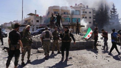 Members of Syrian security forces stand together after Syrian troops entered the predominantly Druze ...
