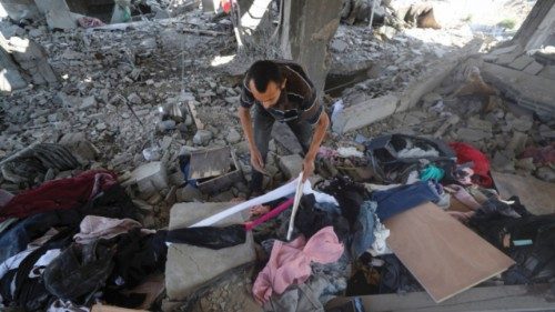 A Palestinian inspects the site of an overnight Israeli strike on a house, in Gaza City July 13, ... A Palestinian inspects the site of an overnight Israeli strike on a house, in Gaza City July 13, ...