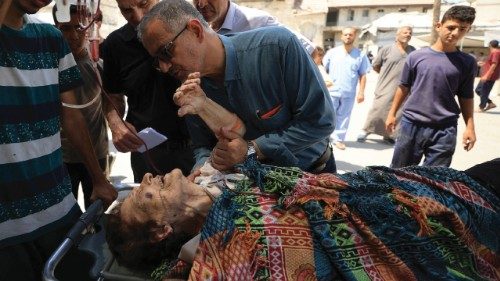 A wounded Palestinian Christian woman is brought into at Al-Ahli Arab Hospital following an Israeli ...