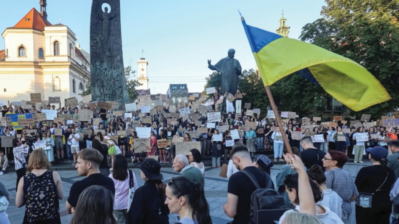Ukrainians protest in the first wartime rally against a newly passed law, which curbs independence ...