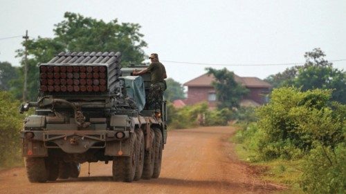 A Cambodian military personnel stands on a BM-21 Grad multiple rocket launcher, around 40 km (24 ...