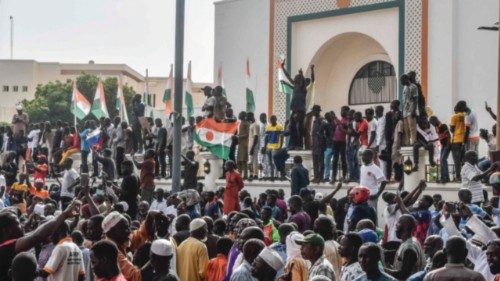(FILES) Supporters wave Nigerien's flags as they rally in support of Niger's junta in front of the ...