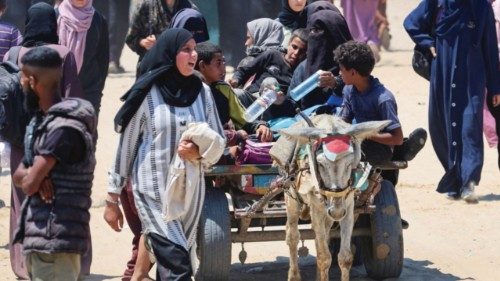 Palestinians seeking aid supplies from the U.S.-backed Gaza Humanitarian Foundation travel in an ... Palestinians seeking aid supplies from the U.S.-backed Gaza Humanitarian Foundation travel in an ...