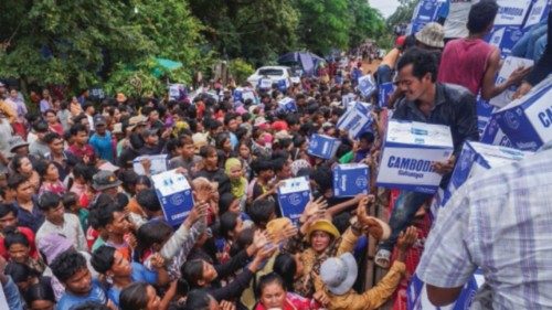 People queue to receive water supplies donated at Batthkao Primary School camp, amid ongoing clashes ... People queue to receive water supplies donated at Batthkao Primary School camp, amid ongoing clashes ...