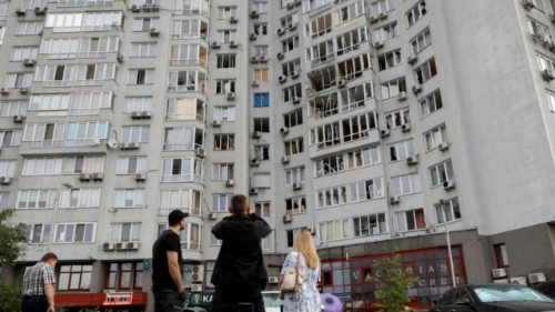 epa12267778 Local people look at a residential building hit in a drone strike in Kyiv, Ukraine, 28 ... epa12267778 Local people look at a residential building hit in a drone strike in Kyiv, Ukraine, 28 ...