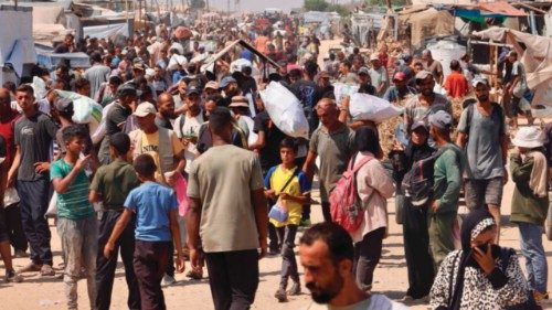 Palestinians carry humanitarian aid they received at the Rafah corridor as they walk in the Mawasi ... Palestinians carry humanitarian aid they received at the Rafah corridor as they walk in the Mawasi ...